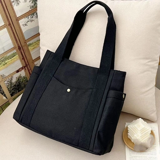 A secure and versatile canvas bag with a zipper, ideal for keeping your belongings safe on the go.