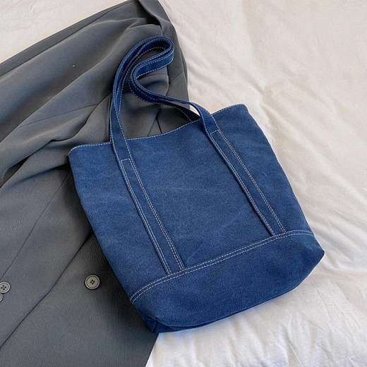 Spacious and durable, this denim tote bag is perfect for everyday essentials.