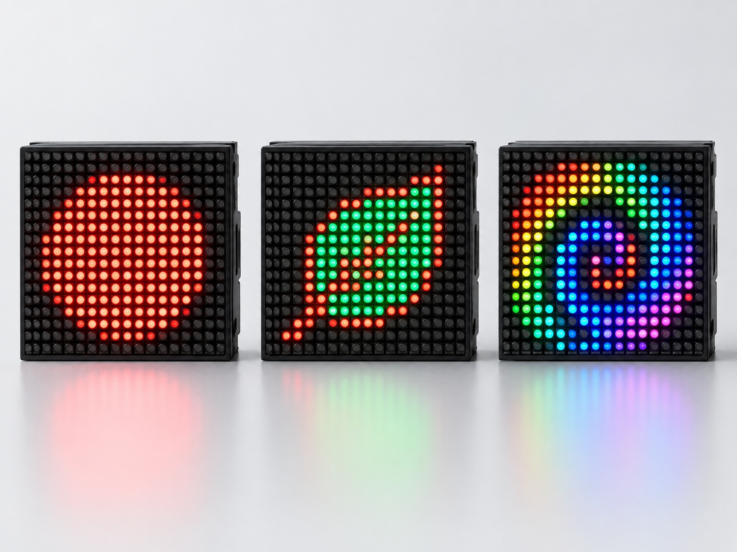 Three dot matrix panels shown together: one glowing red, one mixing two colours and one mixing full colour from red, green and blue dots.
