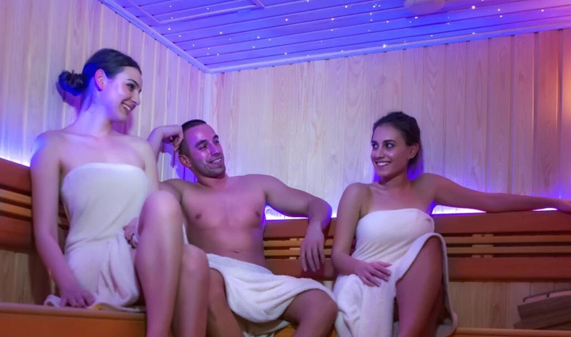 peple in sauna room with color led light