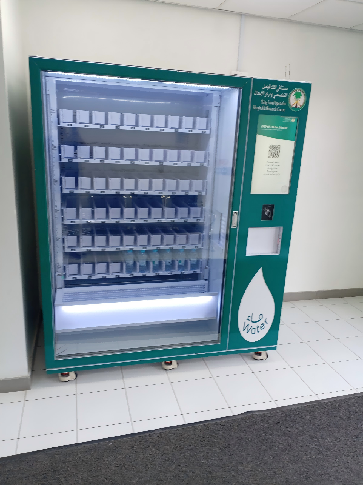 Saudi Arabia large capacity elevator vending machine selling bottled water in a high traffic location.