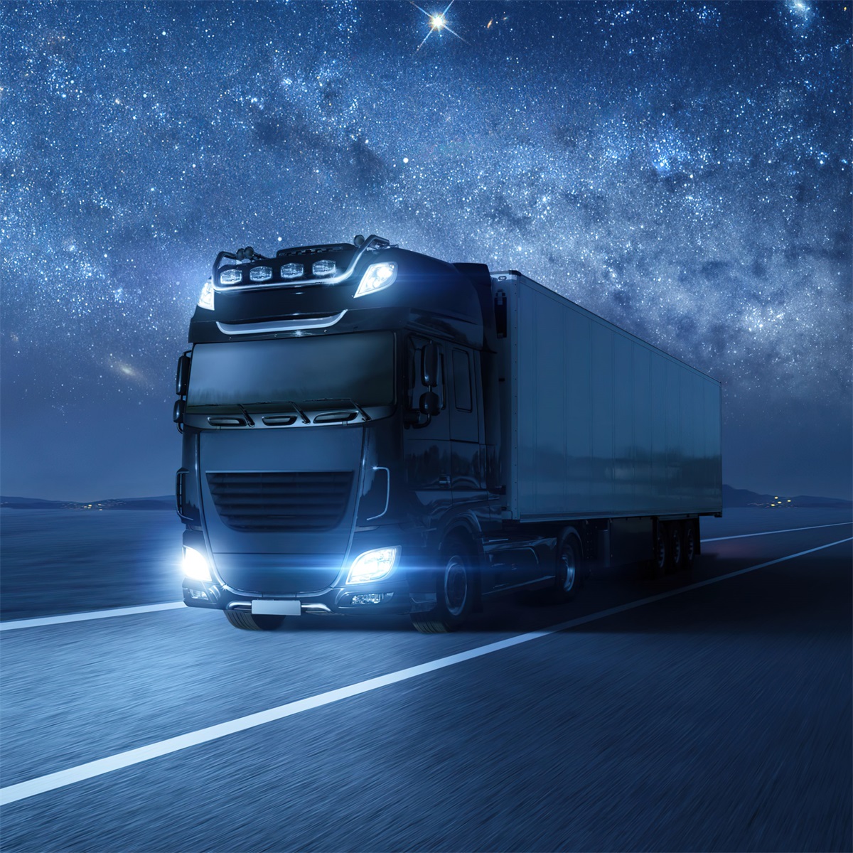 A running truck on highway with bright headlight