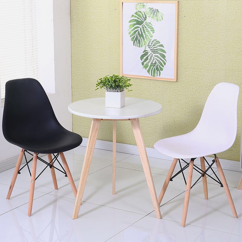 Clear acrylic dining chair with wood legs