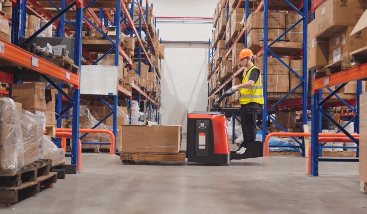 Proactive warehouse machinery care - team conducting safety inspection on conveyor belts to ensure smooth logistics operations.