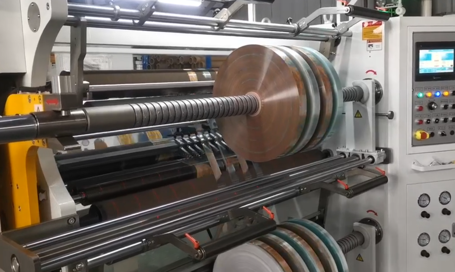 Specialized electrode roll lifter with chrome-plated roller mandrel and dust-proof PC shield transports sensitive pole piece coils through narrow aisles in battery manufacturing facilities.