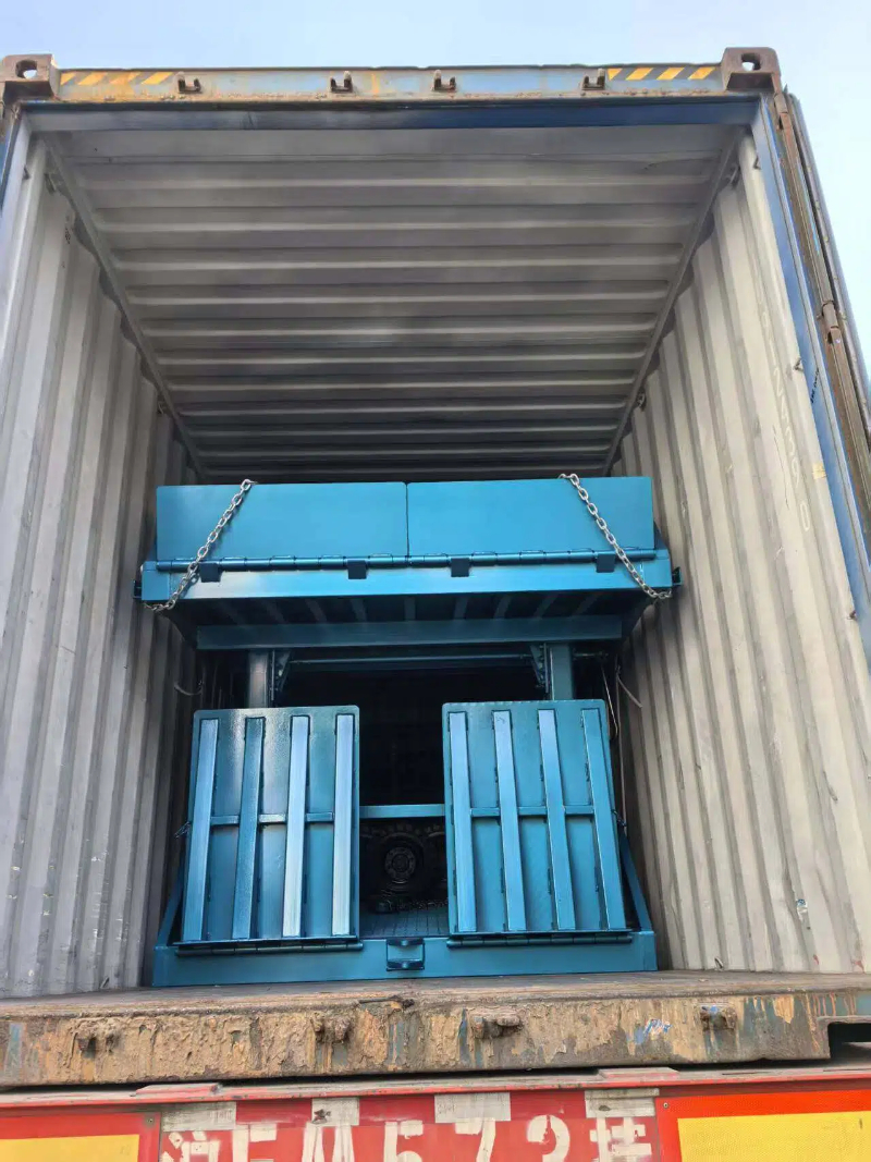 mobile stationary yard ramp with foldable leading board and guard rails, enabling seamless container loading in logistics operations.