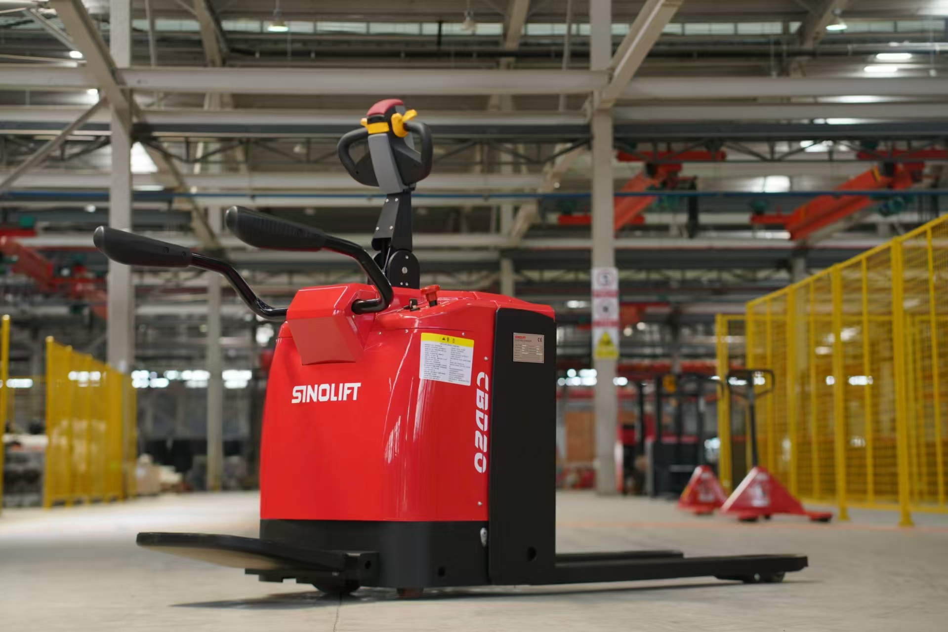 Compact electric pallet truck navigating a narrow warehouse aisle, demonstrating versatility and agility.
