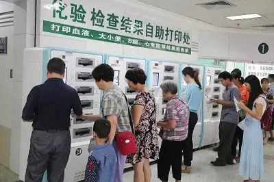 A JUDcare self-service kiosk in a hospital setting enabling patients to print diagnostic reports and access health services independently