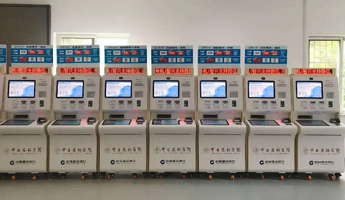 Patient using JUDcare self-serve kiosk for registration.