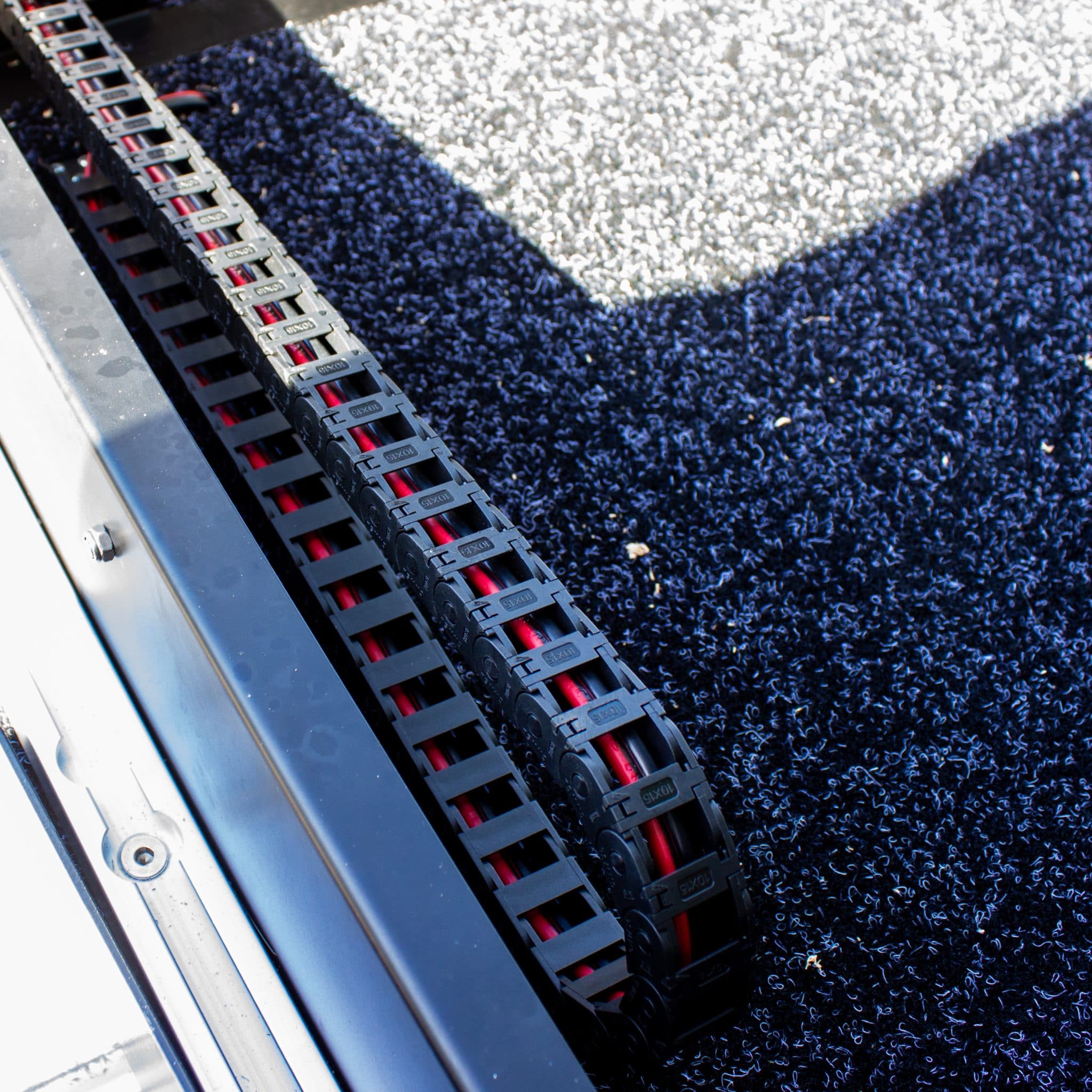 Small form factor energy chain offers efficient cable guidance in compact machinery setups.