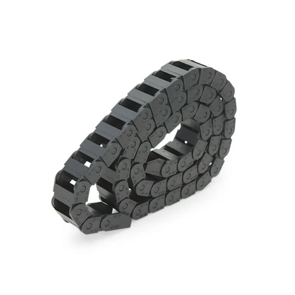 Igus polymer cable carrier for robotics/CNC, flexible wear-resistant motion protection.