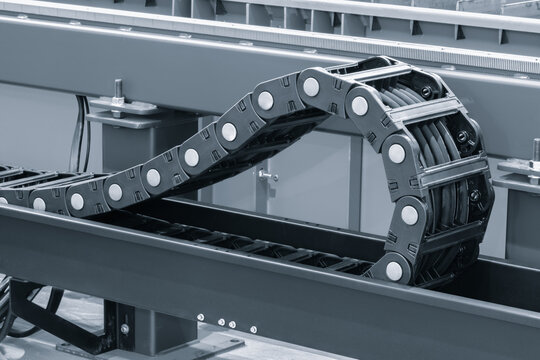 Compact mini drag chain organizing high-speed cables in tight machinery spaces.