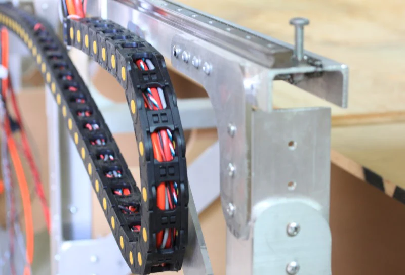 A long-length drag chain ensures stable, durable cable routing for machines requiring extensive travel distances.
