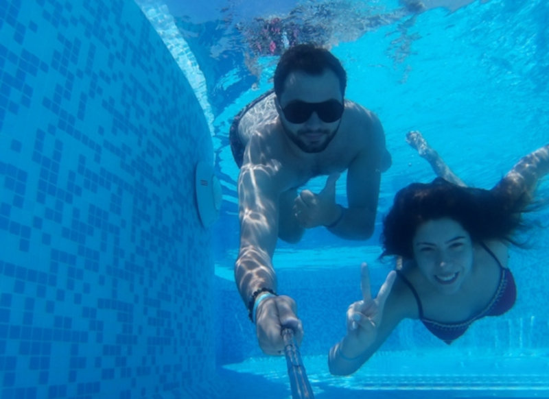 Two People are Taking a Selfie Underwater