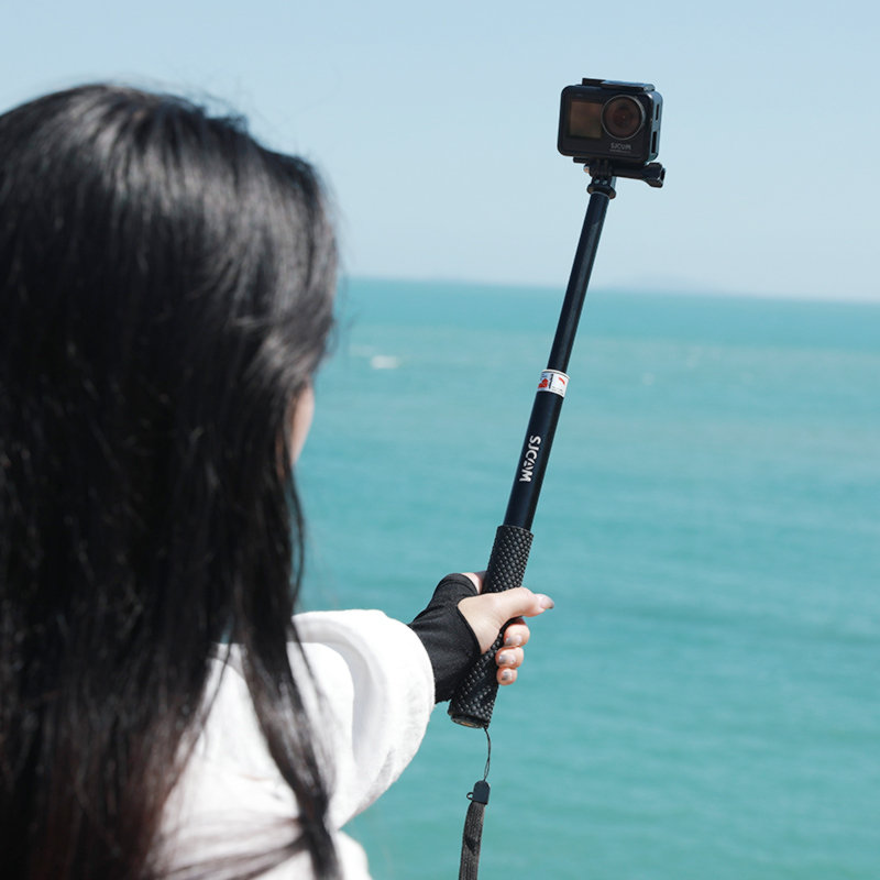 A Person is Taking a Photo with a Selfie Stick