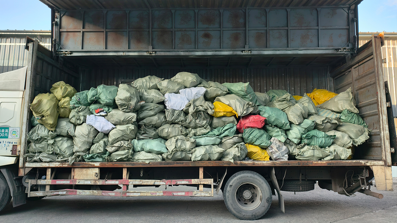 Raw material collection and initial screening in our used clothing factory process