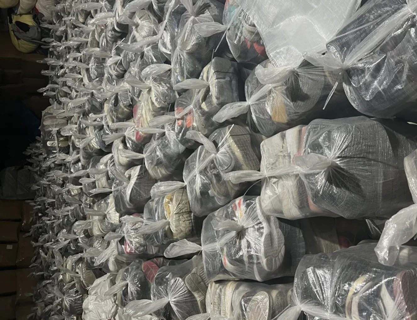 Massive stock of sorted used shoes in China factory warehouse ready for export