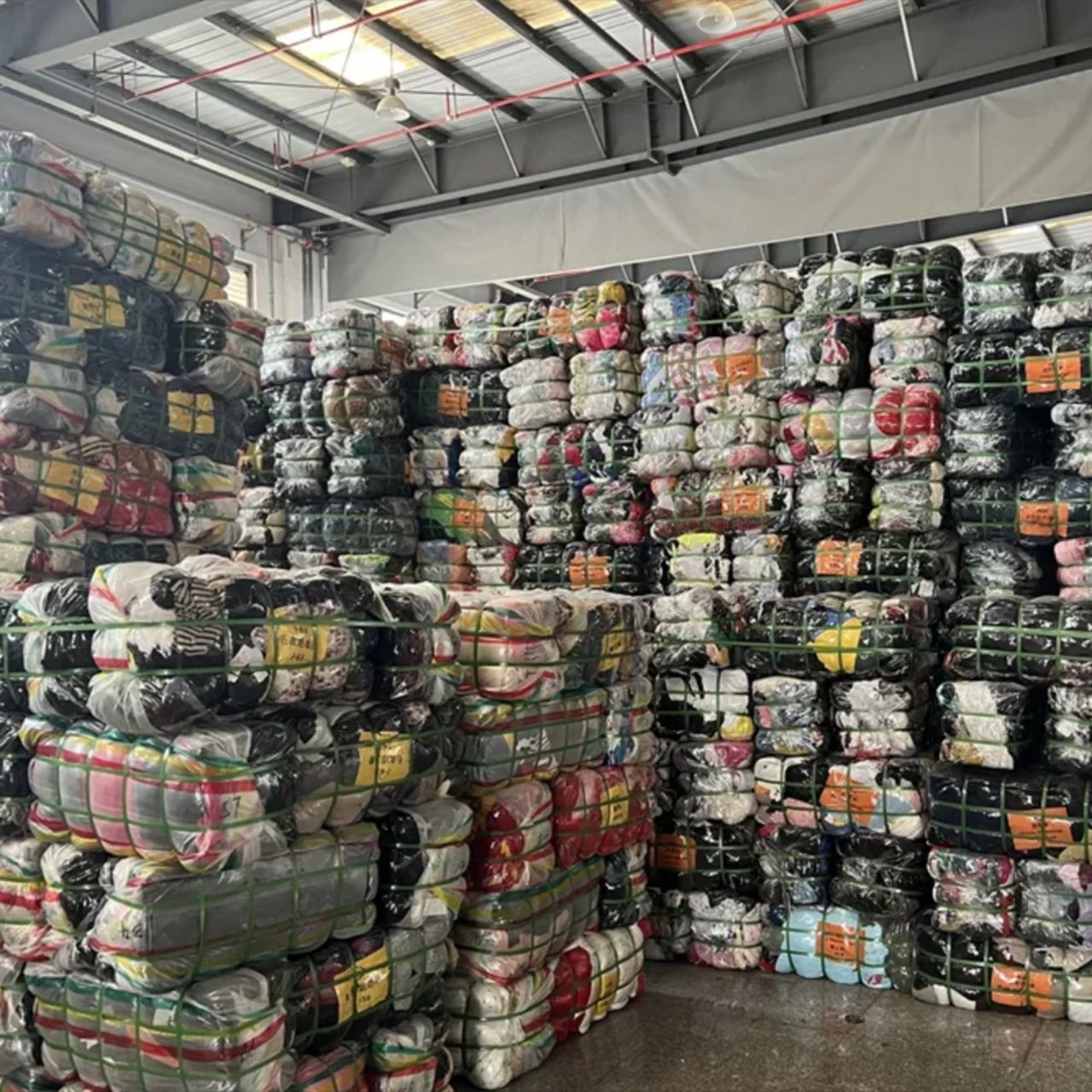 A growing wholesale warehouse showing used clothing business success and scaling