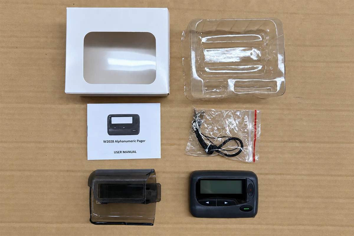 W2028 pager, holster, strap, manual, insert and individual box prepared for packing