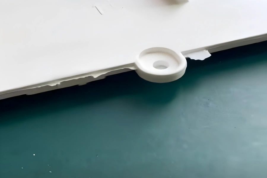 Plastic Part Flash Defect Example Plastic injection molded part showing severe flash defect on the edge