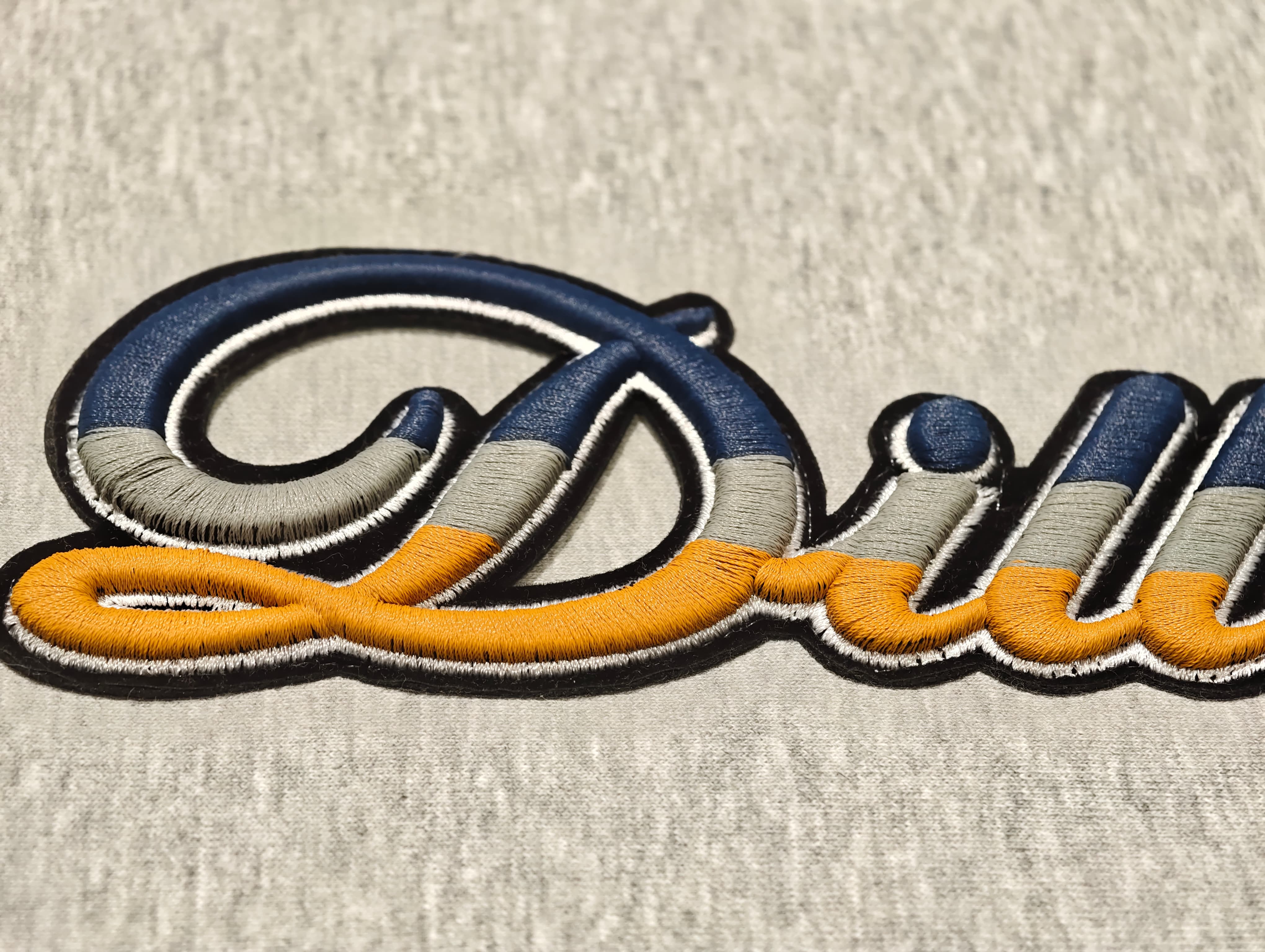 Three-color 3D foam embroidery with layered lettering