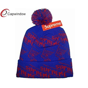 Зимняя шапка с лыжным жаккардовым логотипом и помпоном сверху