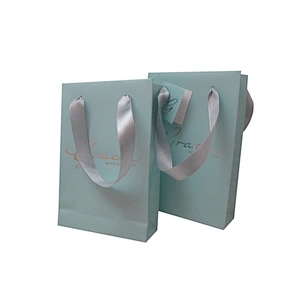 Accept custom printed blue paper bag with ribbon