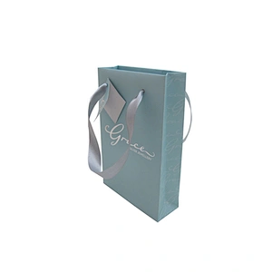 Accept custom printed blue paper bag with ribbon