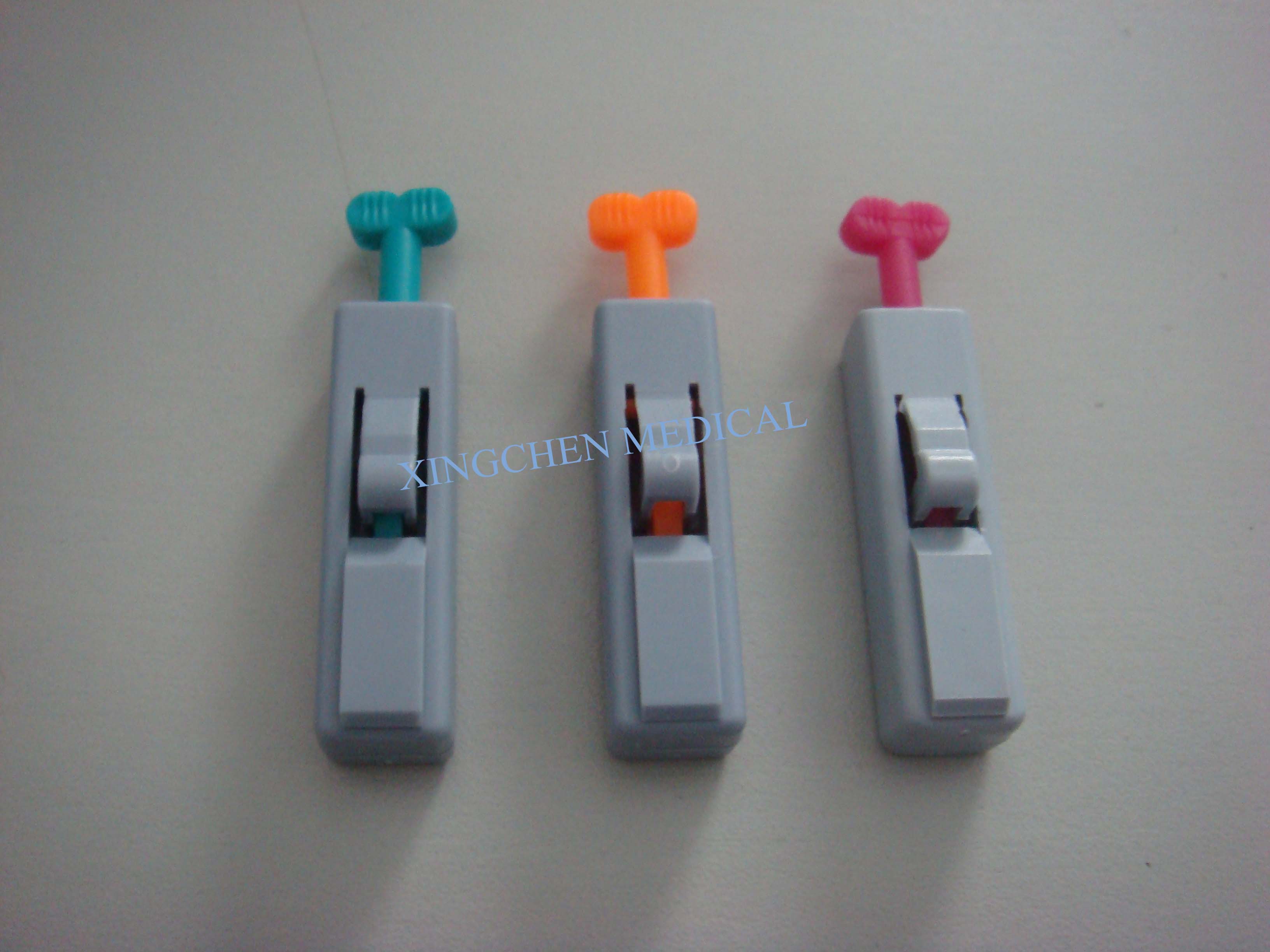 XC1118  Button Type Safety Blood Lancet