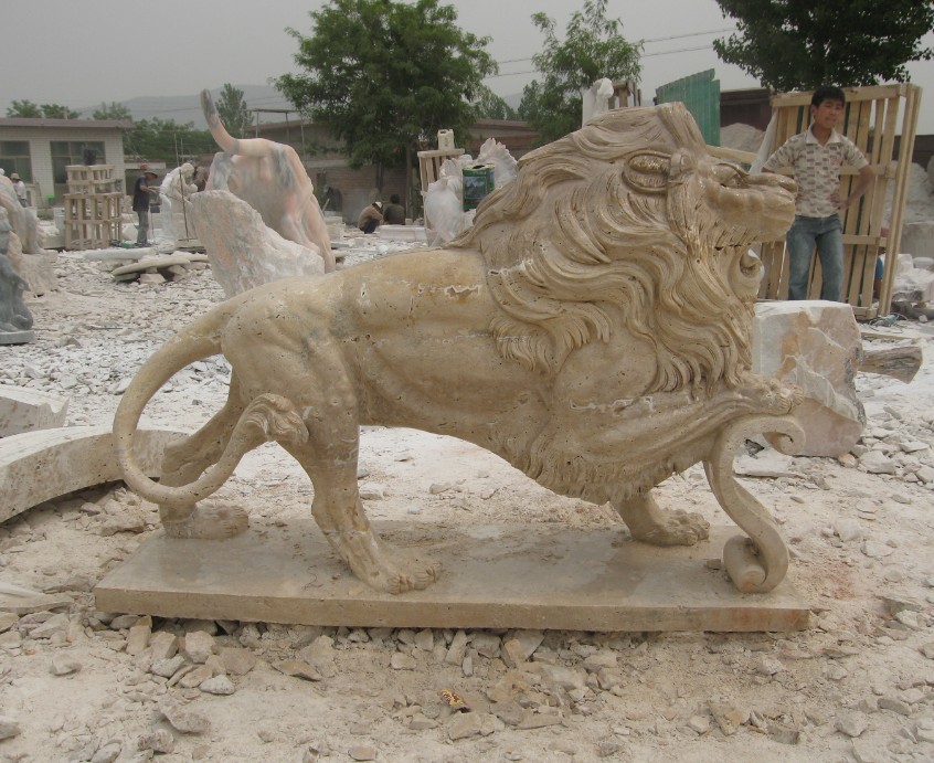 Walking lion stone statue
