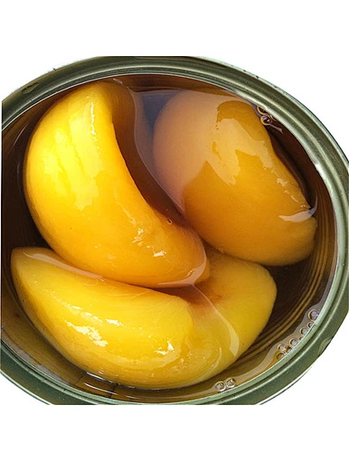 Moitiés de pêches en conserve au sirop