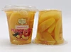 Liste des aliments conservés : Tasses de fruits frais mexicains dans l'eau.