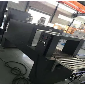 Semi-automatic shrink packaging machine