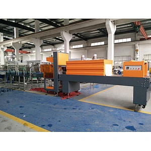 Straight line shrink packaging machine