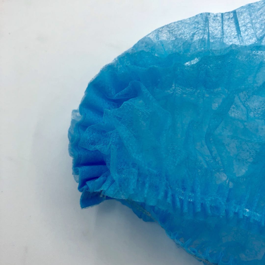blue disposable surgical hat
