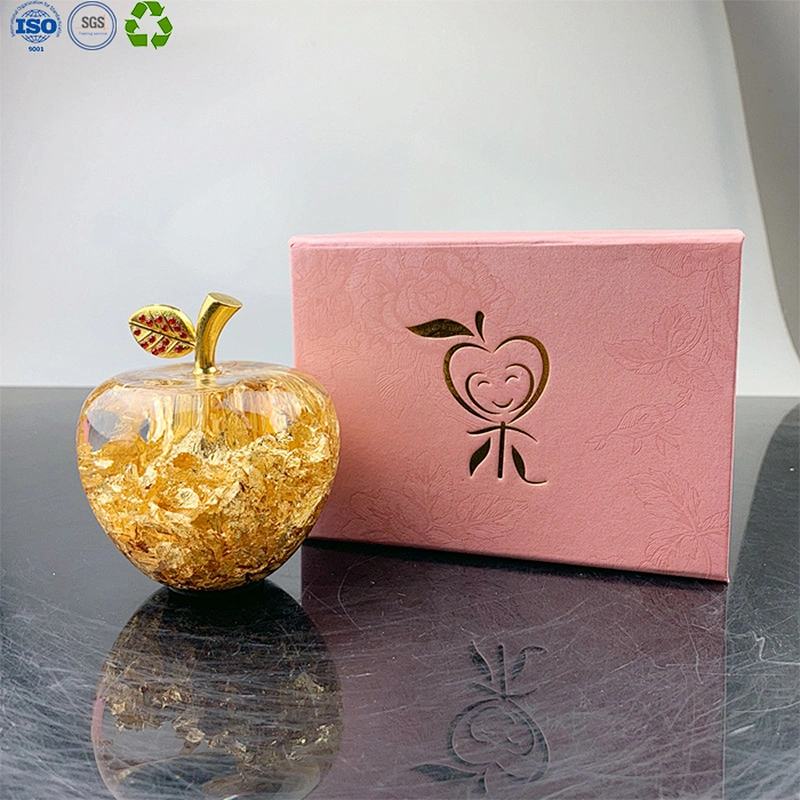 Glass apple with gold leaf
