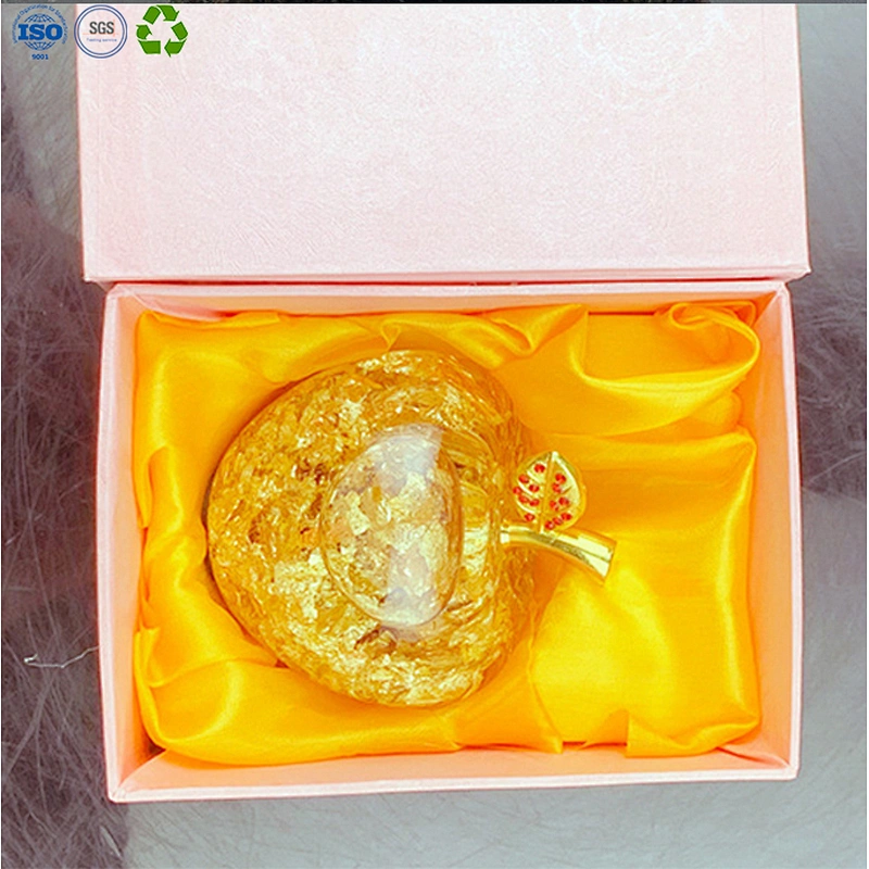 Glass apple with gold leaf