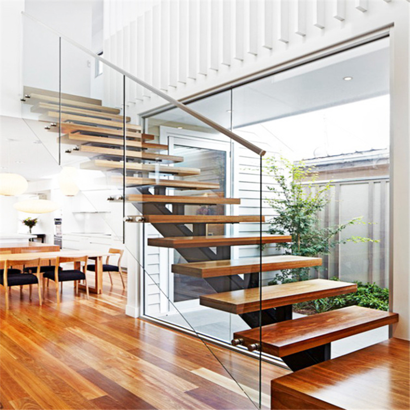 Peldaños de escalera de madera y sistema de barandilla de escalera de vidrio
