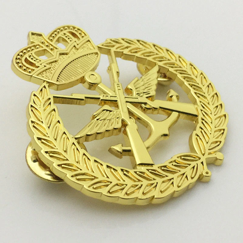 Gold crown and gun lapel pin