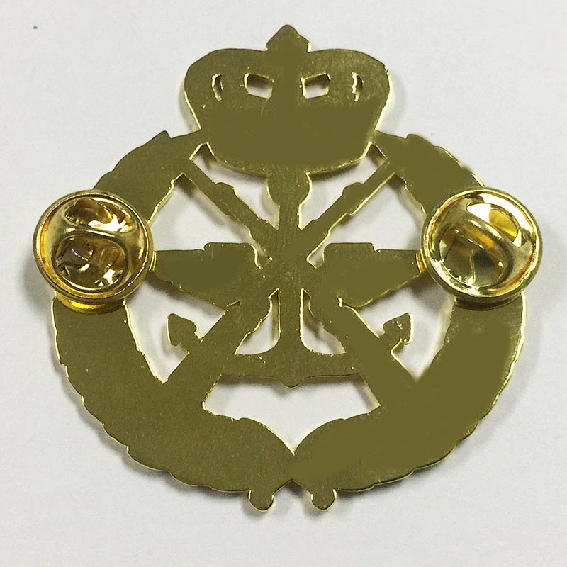 Gold crown and gun lapel pin