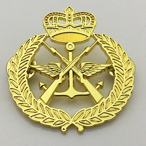 Gold crown and gun lapel pin