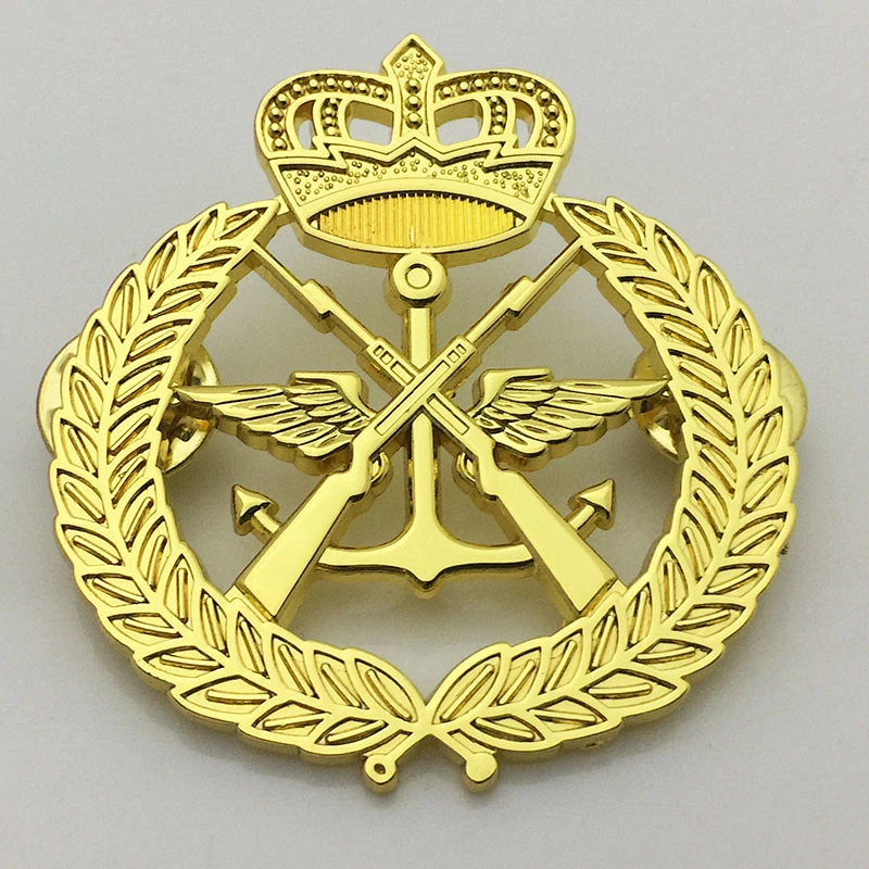 Gold crown and gun lapel pin