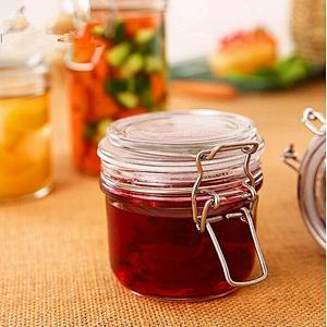 round clear glass food jar with metal clip