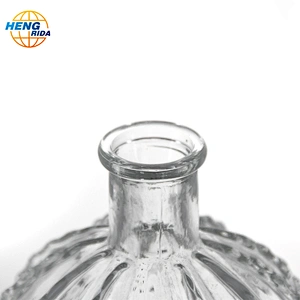 A clear glass cactus ball vase