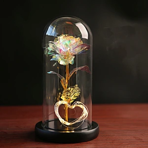 glass jar with wooden cock inside is rose ornament