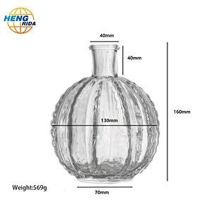 A clear glass cactus ball vase