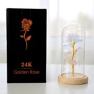 glass jar with wooden cock inside is rose ornament