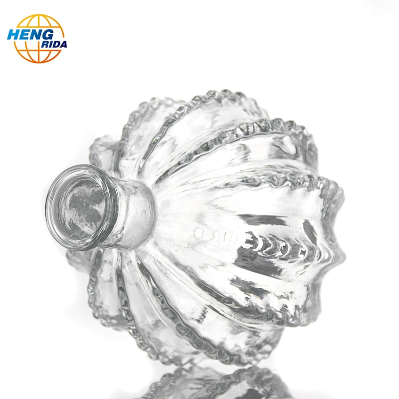 A clear glass cactus ball vase