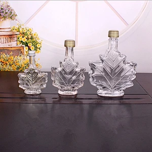 Unique 50ml 100ml 250ml Maple Leaf Shaped Glass Bottle Glass Beverage Bottle Dark Rum bottle with Screw Cap