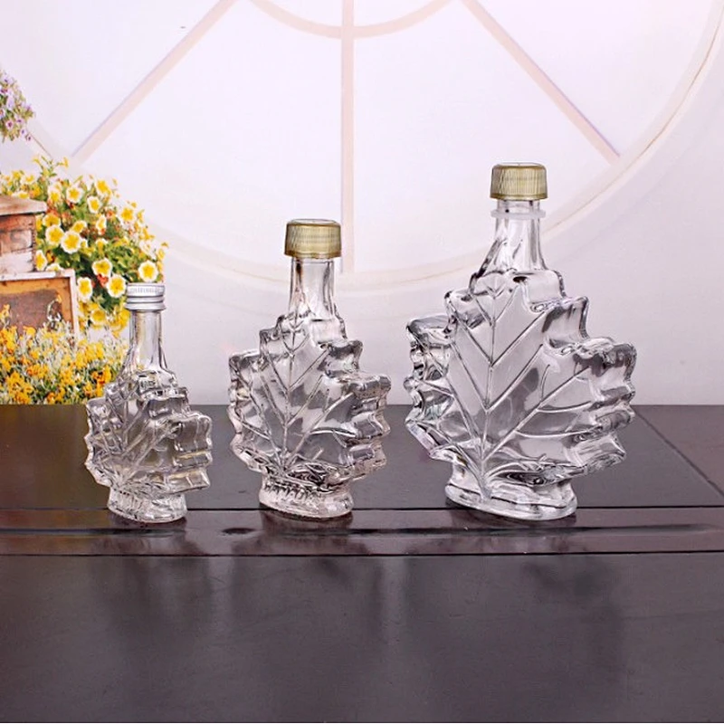 Unique 50ml 100ml 250ml Maple Leaf Shaped Glass Bottle Glass Beverage Bottle Dark Rum bottle with Screw Cap